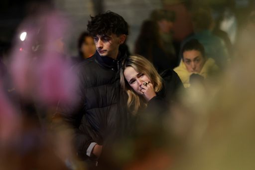 Tears and stunned silence at vigil for Swiss fire victims