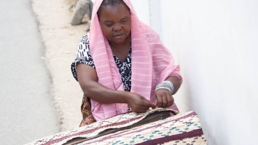 Blind weaver supports family with traditional mat-making