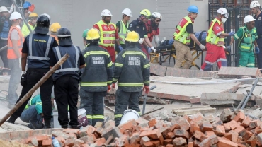 South Africa rescuers contact survivors trapped in collapsed building