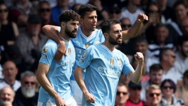 Man city win at Fulham to move top of table