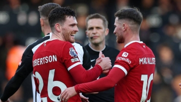 Liverpool win at Fulham to keep league title hopes alive