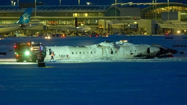 All on board survive after plane flips on Toronto runway