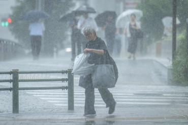 Central Tokyo lashed with record 34 straight days of rain