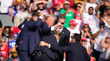 Trump 'fine' after being rushed from rally stage as shots heard