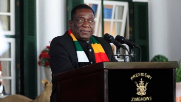 Zimbabwe's president hands over power for vacation