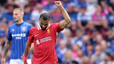 Salah breaks scoring record as Liverpool's new era starts with a win