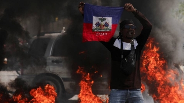 Haiti capital paralysed as gang boss vows to block PM's return from Kenya