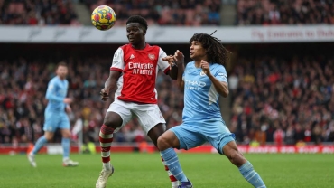 When two teams are likely to win EPL, where is trophy taken to?