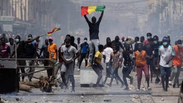 Senegal bans protests over election delay