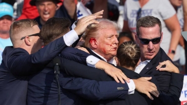 Trump evacuated from rally stage after apparent shots heard